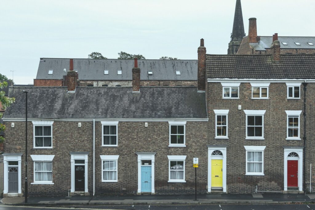 Row of period terraced houses with colourful front doors in a conservation area