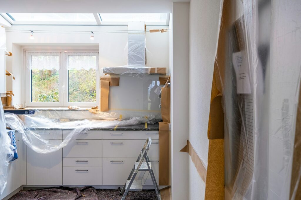 Kitchen mid-renovation with new cabinetry being fitted